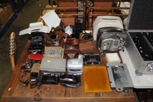 A quantity of various cameras and accessories to i