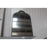 A metal framed wall mirror (124)