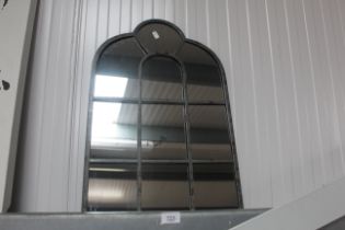 A metal framed wall mirror (124)