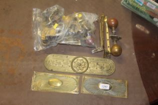 A quantity of brassware to include plaques; door f