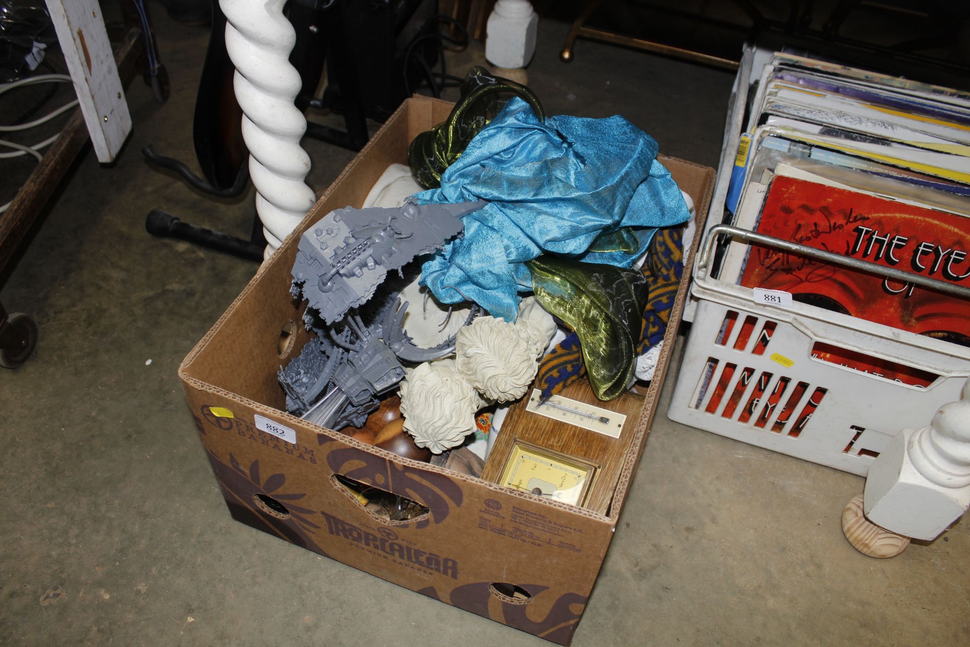 A box containing various toys; turned wooden fruit