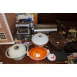 A quantity of kitchenalia to include Le Creuset and other casserole dishes, bread bin, pasta machine