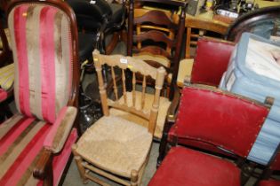 An oak ladder back rush seated rocking chair and a