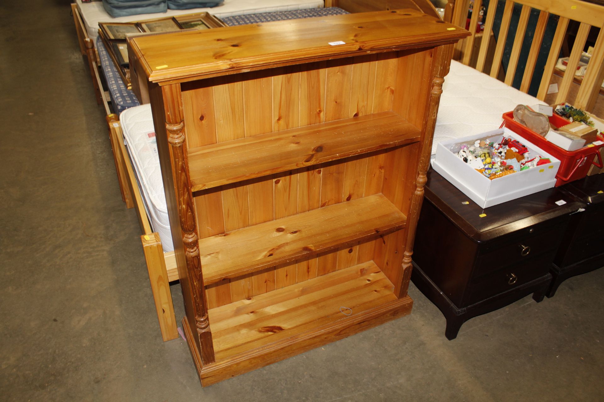 A pine open fronted bookcase