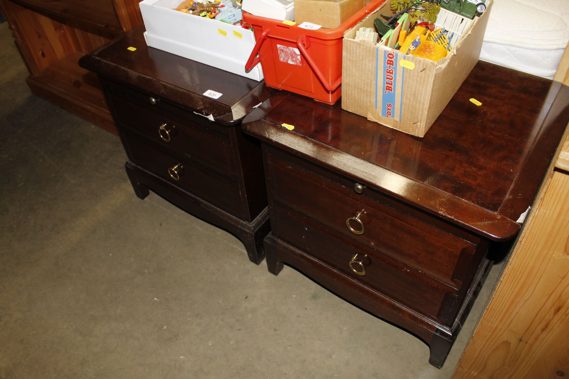 A pair of stag two drawer bedside chests