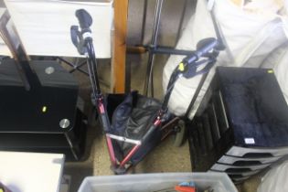 A folding stroller with brakes, shopping bag attac