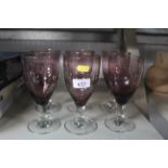 A set of six amethyst coloured glasses