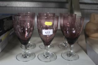 A set of six amethyst coloured glasses