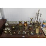 A collection of brassware including trivet, fire i