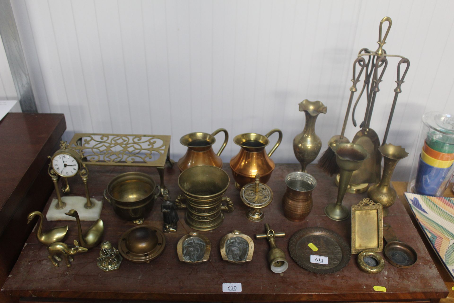 A collection of brassware including trivet, fire i
