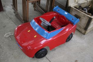 A small child's pedal cart