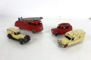 Two models of fire engines and two ambulances