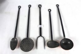 A set of five copper and steel kitchen utensils