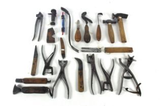 A box of shoe making or repairing tools to include