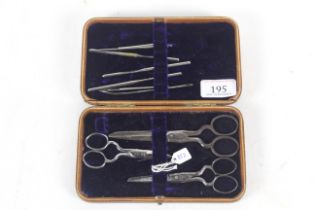 A leather cased manicure set