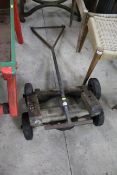 Two axles with wheels and a handle for a stationary engine trolley