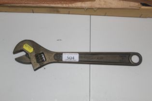 A brass 12" adjustable spanner by Ampo USA