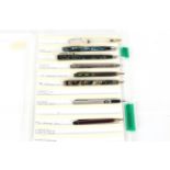 A case containing eight various pens to include Eversharp mechanical pencil, Pilot Verdi compression