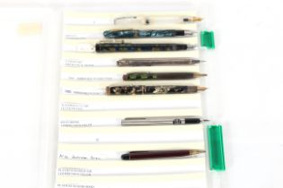 A case containing eight various pens to include Eversharp mechanical pencil, Pilot Verdi compression