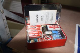 A Bradex First Aid kit in metal tin