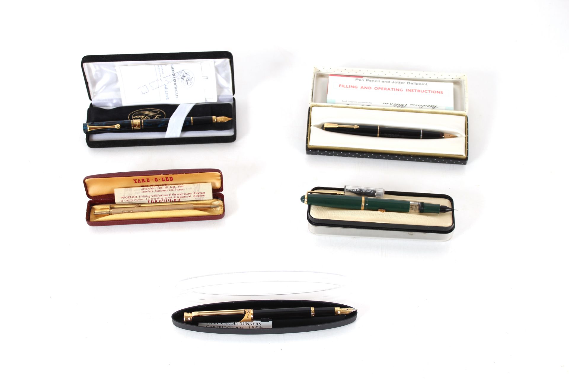 A cased Parker fountain pen, a further cased fountain pen, La Plume fountain pen in case, a