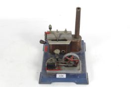 A Mamod style steam engine with burner, pulley whe