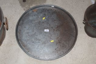 A circular metal tray