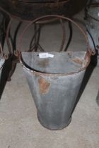 A bucket wall planter with swing handle