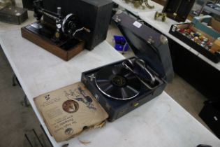 A Decca wind-up gramophone with eighteen 12" 78rpm