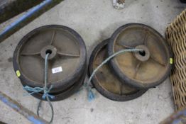 A set of four vintage cast iron and solid rubber w