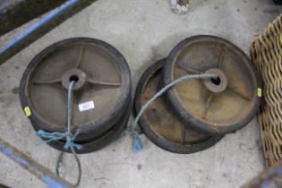 A set of four vintage cast iron and solid rubber w