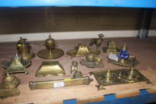 A quantity of brass inkwells of various shapes inc