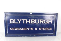 A wooden 'Blythburgh Newsagents and Store' sign, approx. 43½" x 19½"
