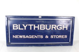 A wooden 'Blythburgh Newsagents and Store' sign, approx. 43½" x 19½"