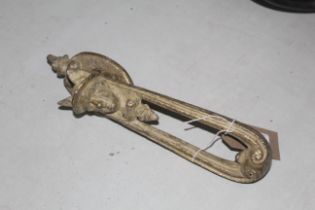 A cast iron door knocker depicting Mercury