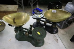 Two sets of small domestic scales with brass pans