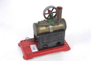A Mamod steam engine with pulley and burner
