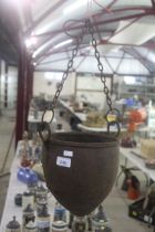 A metal hanging pot