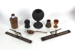 A collection of antique treen including a bottle c