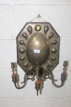 A 19th Century brass wall sconce with triple branc