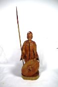 A wooden figure of a cloaked knight (height of knight approx. 41") holding a shield and spear AF