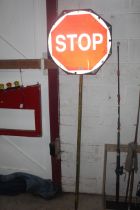 A vintage "Stop / Go" sign