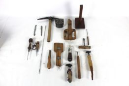 A box of tools including two lever pincers, a long