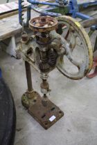 A hand operated bench drill