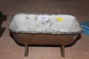 A small cast iron trough