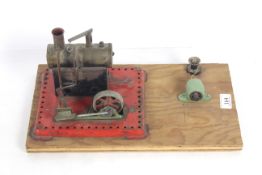 A Mamod style model steam engine with burner and p