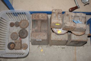 Three 56lb Avery weights, various 7lb weights and