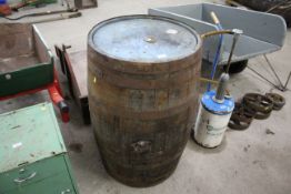 A large wooden and metal bounded whisky barrel