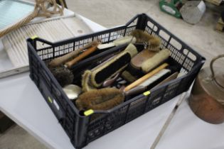 A crate of various cleaning brushes