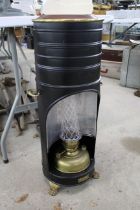 A small Ardent of Belgium oil heater with glass a